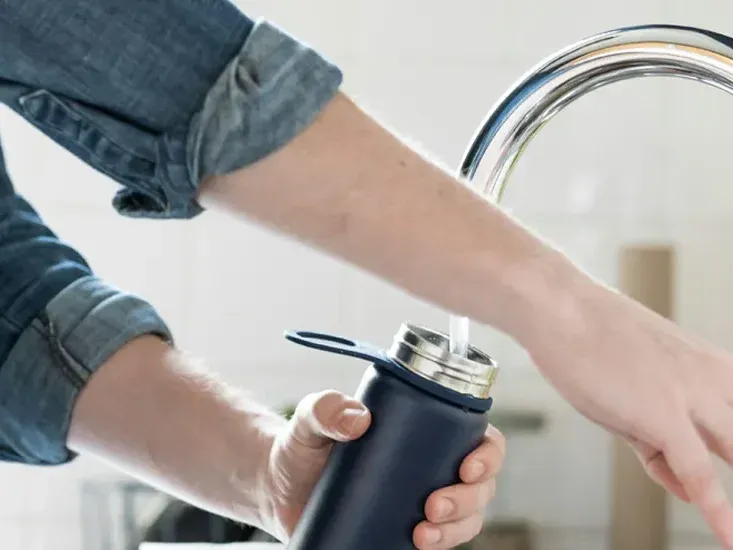Water running at a Nampa kitchen faucet — pressure and clarity are early water line signals